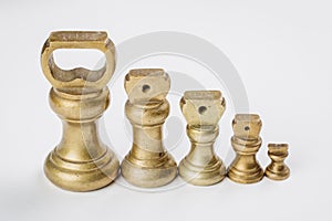 Different vintage brass weights unit standing