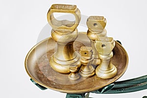 Different vintage brass weights unit standing