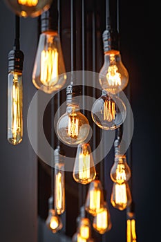 Different vintage tungsten filament lamps hanging from the ceilin