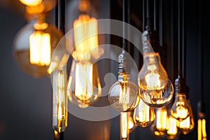 Different vintage tungsten filament lamps hanging from the ceilin