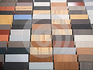 Different wooden parquette or laminate pieces samples at furniture store
