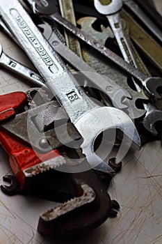 Different wrenches on a metal background photo