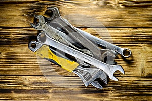 Different wrenches on a wooden table