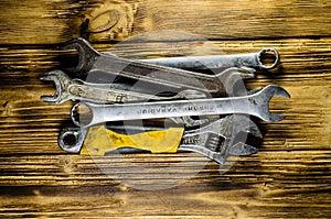 Different wrenches on a wooden table