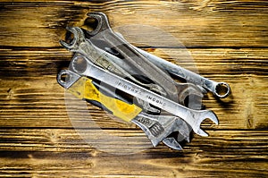 Different wrenches on a wooden table