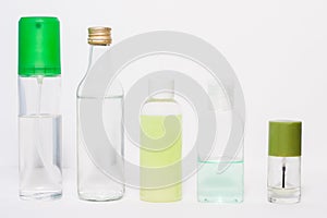 Differently shaped clear cosmetic bottles