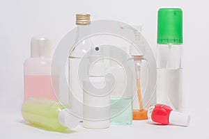 Differently shaped white cosmetic bottles