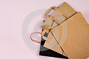 Differents recyclable paper bag on pink background. Eco recycling concept. Top view