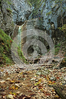 Difficul trail with ladder near the waterfall in canyon of National park Slovak paradise