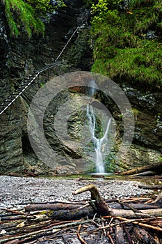 Difficul trail with ladder near the waterfall in canyon of National park Slovak paradise