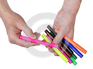 Difficult agonizing choice of a colored felt-tip pen from a heap