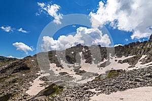 Difficult hiking trail going uphill through the rocks, Pirin mountains, Bulgaria.