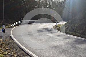 country road curve with low sun