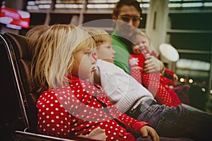 Difficulties in travel with kids-angry unhappy little girl wait in airport with family