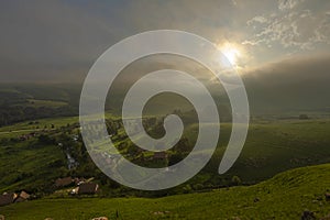 Diffused sunlight through low clouds at sunset