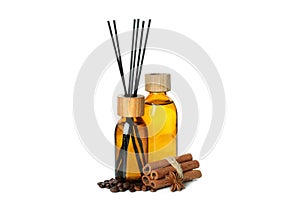 Diffusers, coffee beans and cinnamon sticks isolated on white background