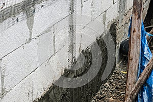 dig soil prepare plaster cement. lightweight cement brick and white lintel plasters to joint for reinforce widow house frame in