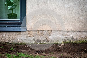 Diged ground near the foundations of the house for insulation and renovation