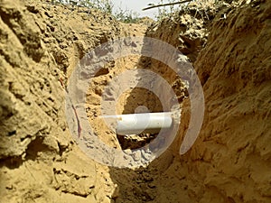 Digged pit or dent to add a new water connection to municipal water supply pipe line