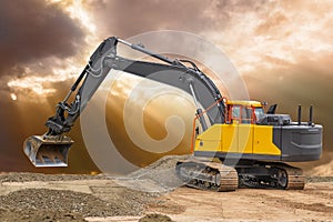 Digger and excavator at work in construction site