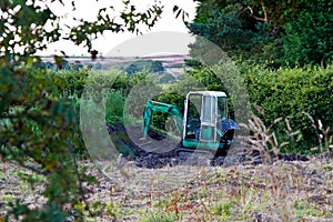 Digger abandoned in a bush