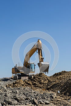 Digger fills truck