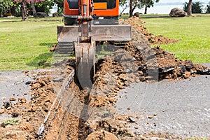 Digger machine operate for digging soil and repair road in the p