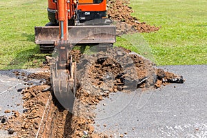 Digger machine operate for digging soil and repair road in the p