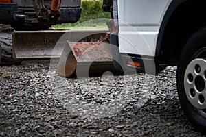 Digger and truck at construction site