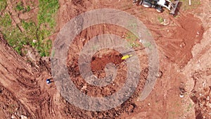 Digger truck near trench with yellow pipe upper view