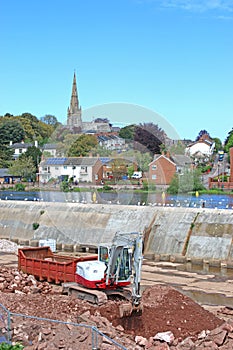 Digger working on Exeter flood defences