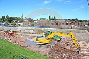 Digger working on Exeter flood defences