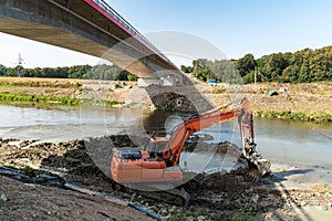 Digger working on the new bridge construction site