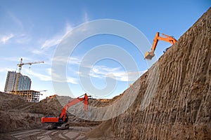 Digging the pit foundation a hole with excavator