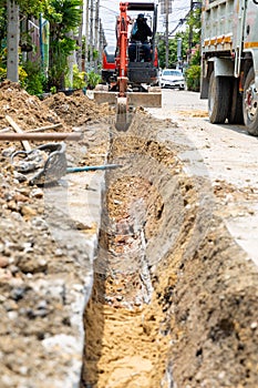 Digging road before install Pipe Water. Excavation water drainage at construction site. Digging roads to lay pipes 8 inches. The r