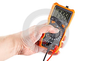 Digit 1488 on lcd screen of digital electrical multimeter in left hand, isolated on white background photo
