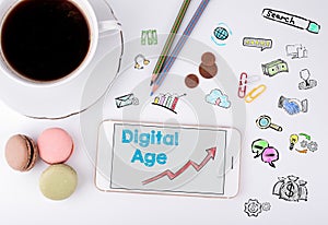 Digital Age, Business Concept. Mobile phone and coffee cup on a white office desk