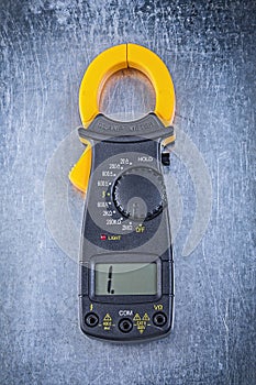 Digital ammeter on metallic background
