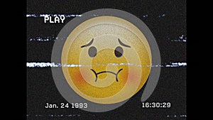 Digital animation of vhs effect over sick face emoji against black background