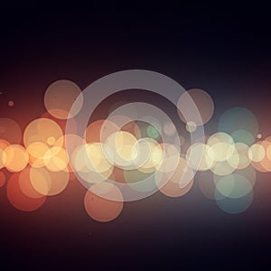 A digital artwork featuring an abstract bokeh effect with circular, overlapping light