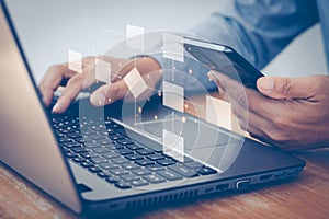 Digital automation concept. Businessman using a computer laptop analysis for process and workflow automation with flowchart,