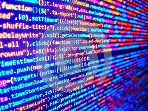 Digital binary data on computer screen. Abstract source code background. Developer occupation work photo. Programming code typing