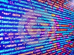 Digital binary data on computer screen. Programming code. Coding programmer abstract background. Software engineer at work.