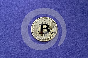 Digital bitcoin on a purple background.