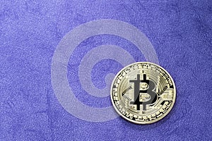 Digital bitcoin on a purple background.