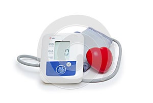 Digital blood pressure meter with love heart symbol on white background