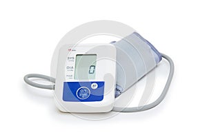 Digital blood pressure meter with love heart symbol on white background