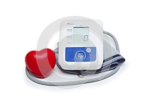 Digital blood pressure meter with love heart symbol on white background