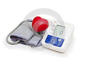 Digital blood pressure meter with love heart symbol on white background