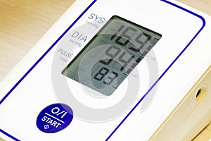 The digital blood pressure monitor shows very high arterial blood pressure and heart rate. Medical pressure measuring device